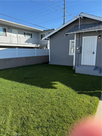 a view of a patio with a table and chairs