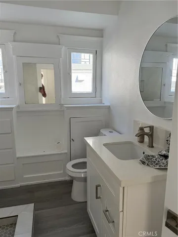 a view of a room that has wooden floor in it