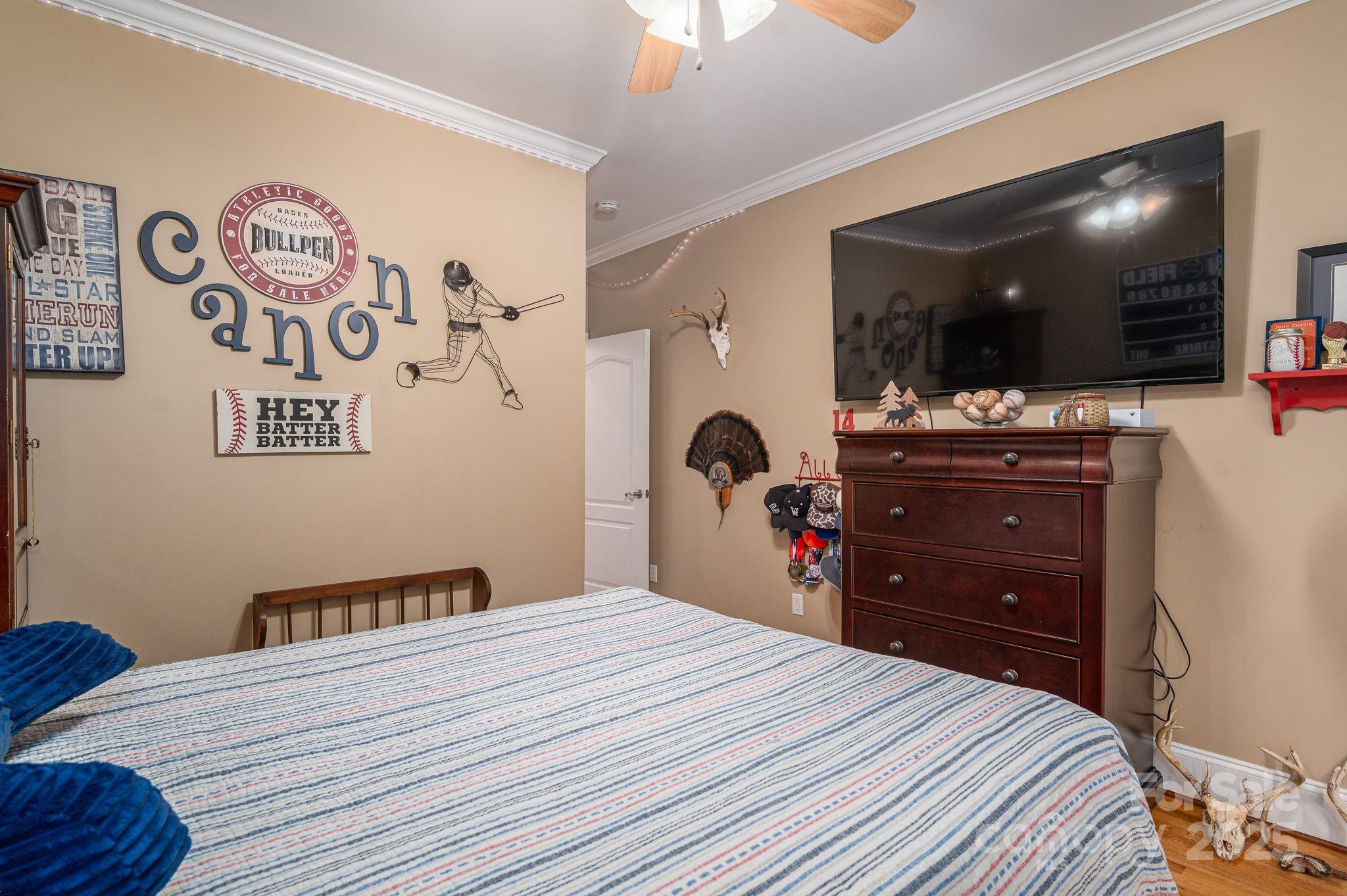 543 Roy Eaker Road Cherryville, NC 28021 - Photo 17 of 43 a bedroom with a bed and a flat screen tv
