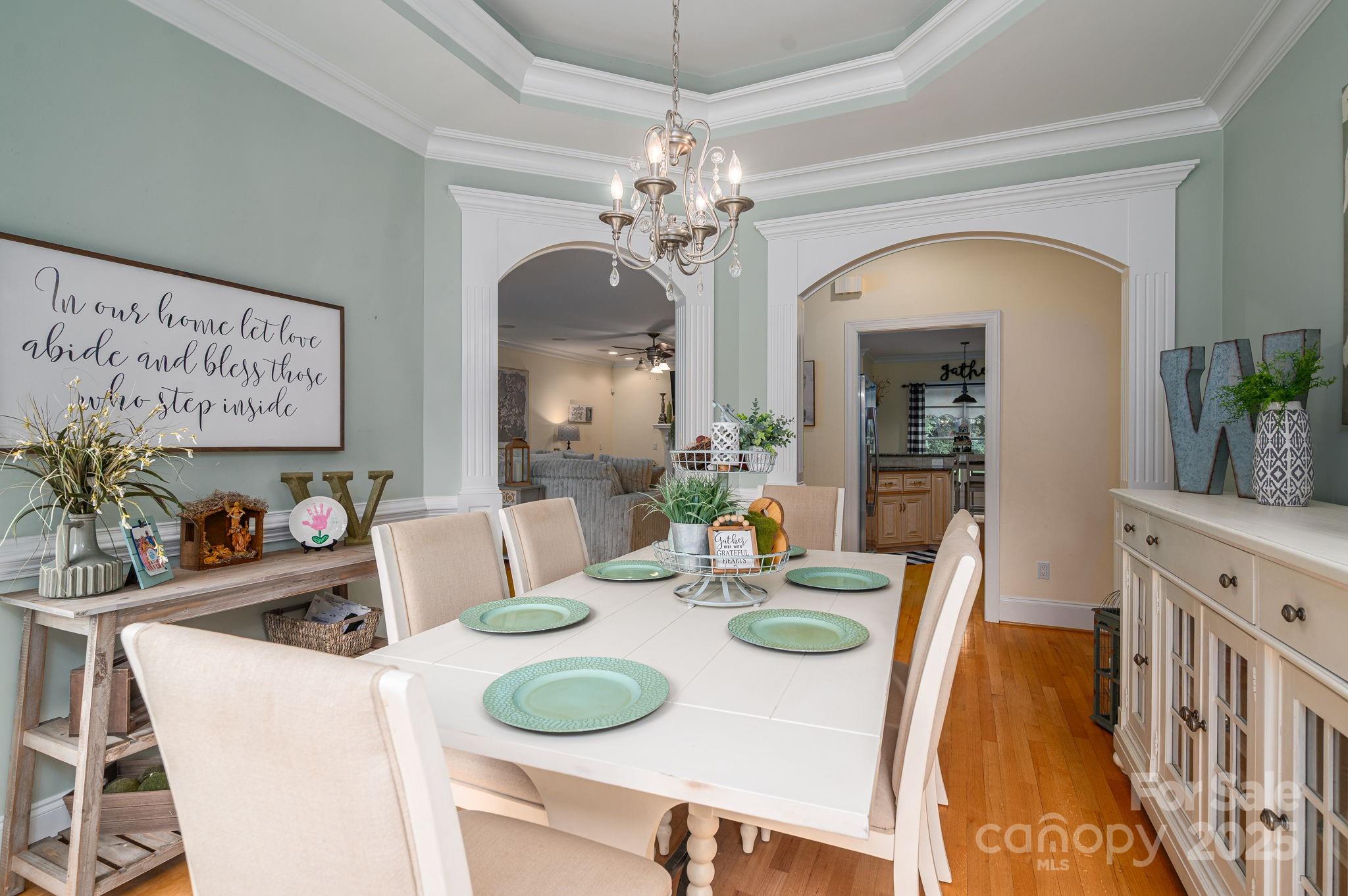 543 Roy Eaker Road Cherryville, NC 28021 - Photo 18 of 43 a view of a dining room with furniture and chandelier