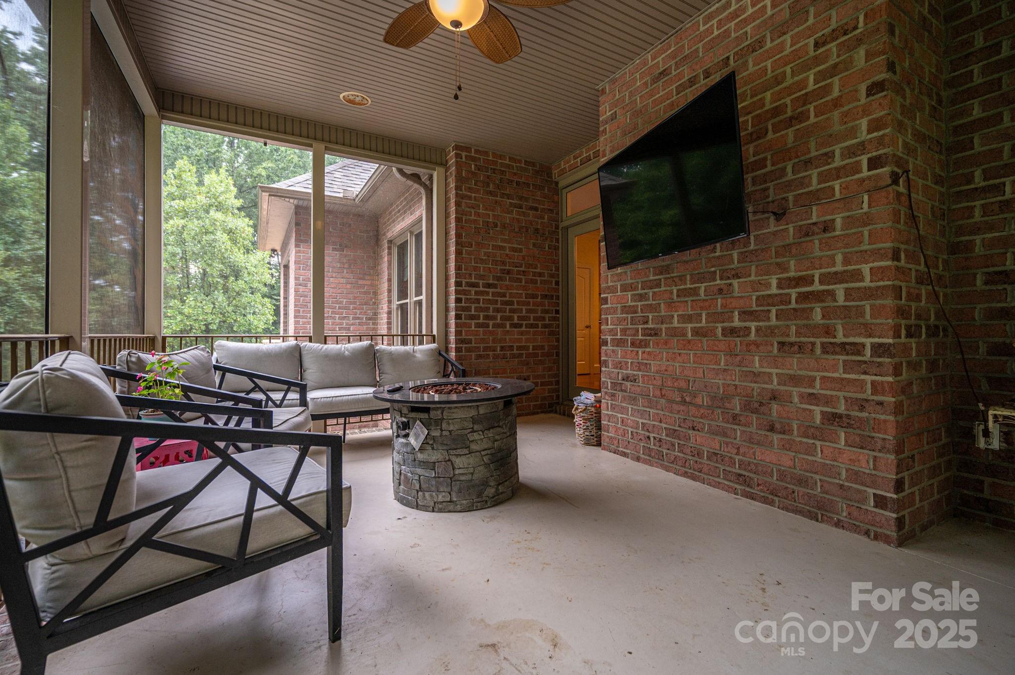 543 Roy Eaker Road Cherryville, NC 28021 - Photo 34 of 43 a living room with patio furniture and a flat screen tv