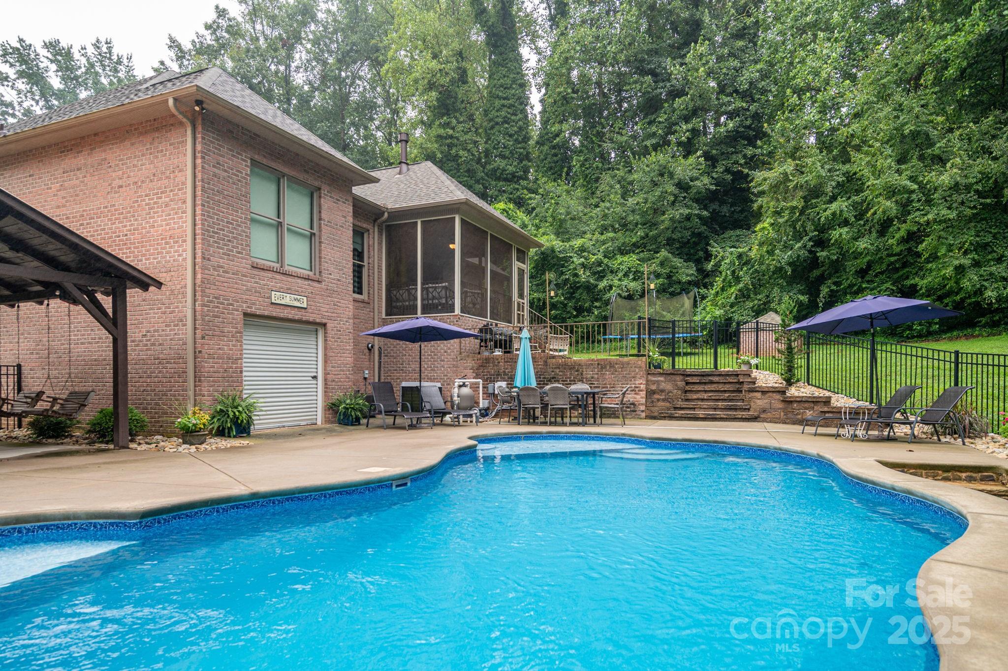 543 Roy Eaker Road Cherryville, NC 28021 - Photo 37 of 43 a swimming pool with outdoor seating and yard