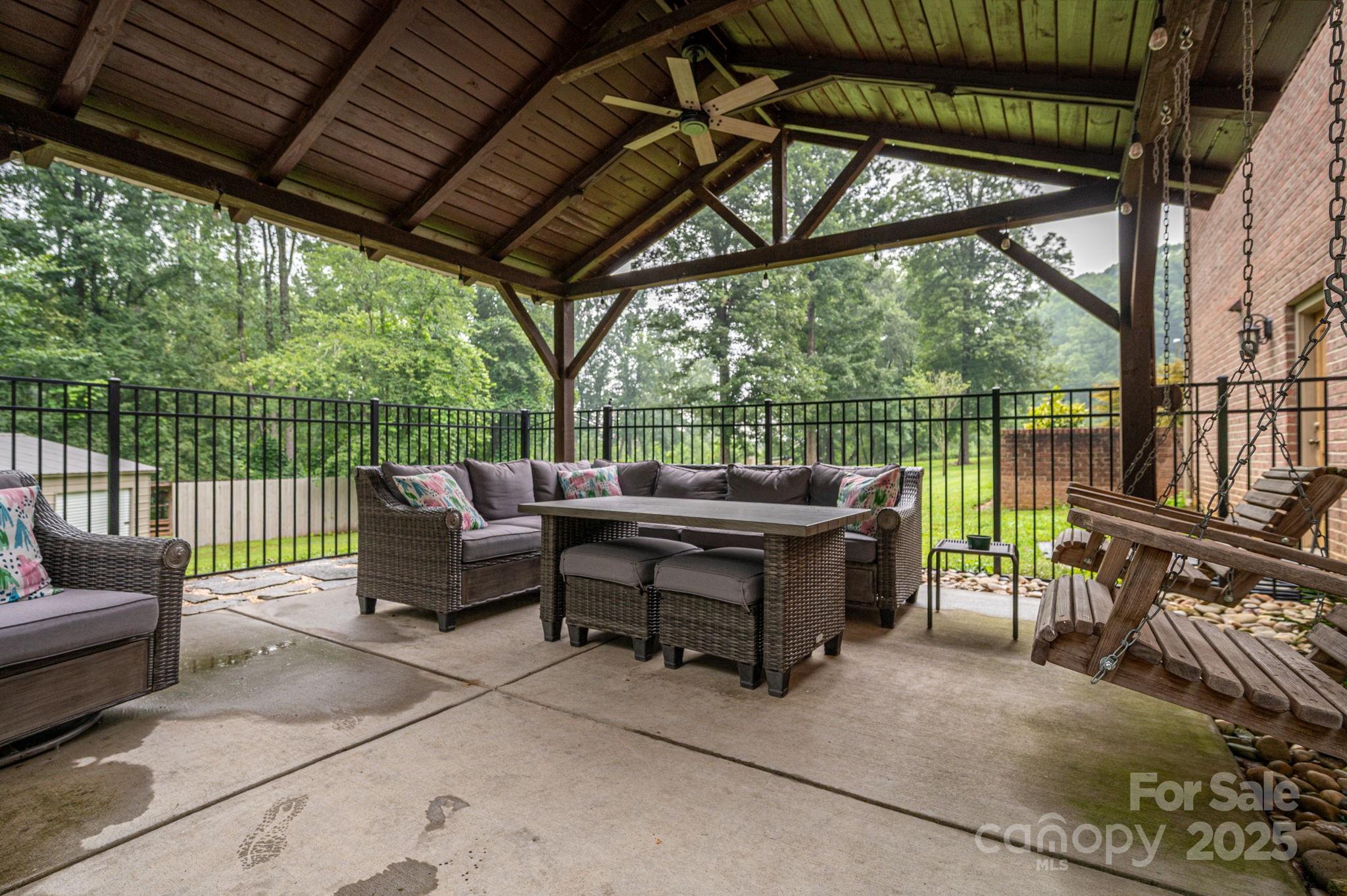 543 Roy Eaker Road Cherryville, NC 28021 - Photo 38 of 43 a view of a chair and tables in the patio