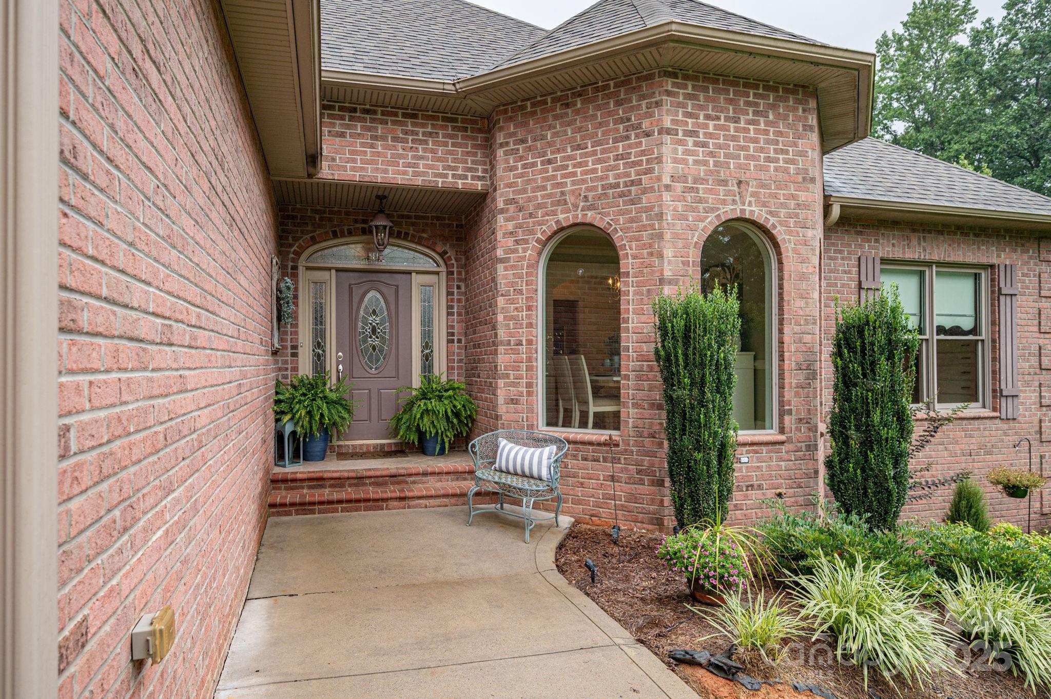 543 Roy Eaker Road Cherryville, NC 28021 - Photo 4 of 43 a front view of a house with garden