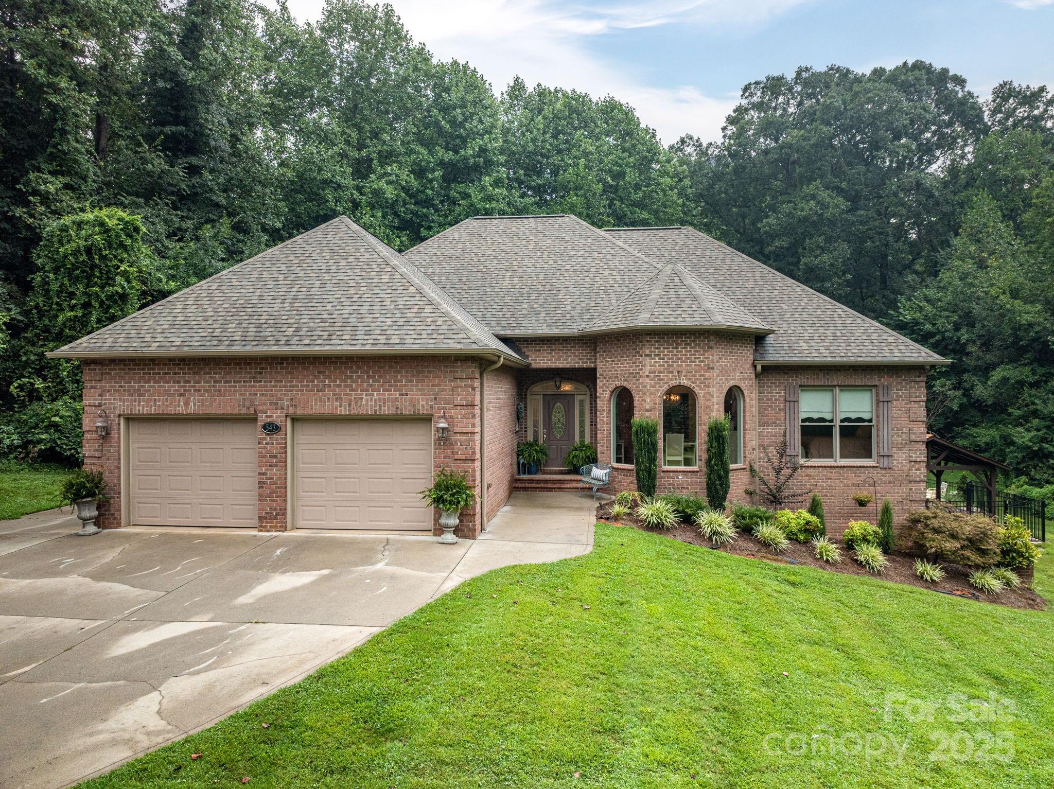 543 Roy Eaker Road Cherryville, NC 28021 - Photo 5 of 43 a front view of house with yard and outdoor seating