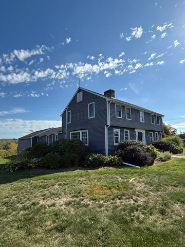 a view of a yard in front of a house with a yard