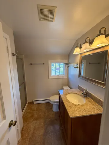 a view of room with window and hardwood floor