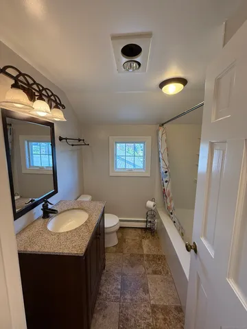 a bathroom with a bath tub and a shower
