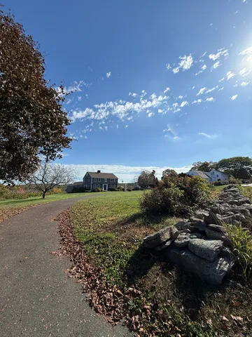 a view of a town with mountains in the background