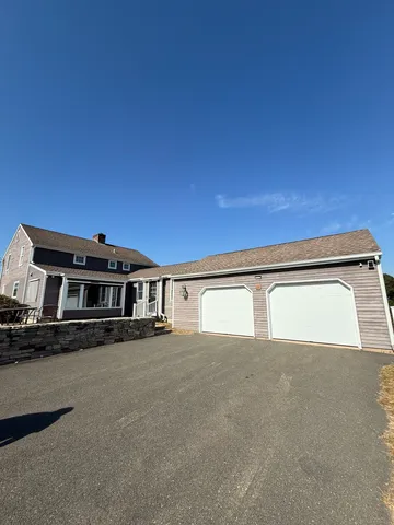 a view of a house with a street