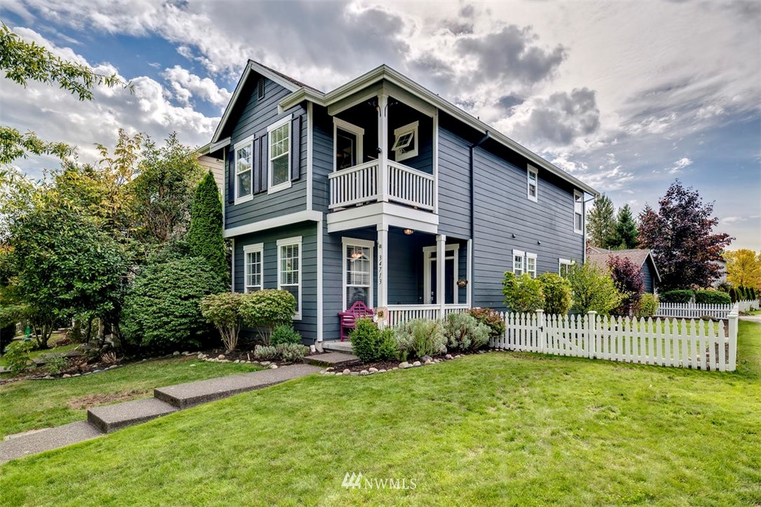 34713 Southeast Ridge Street Snoqualmie, WA 98065 - Photo 1 of 22 a front view of a house with a yard
