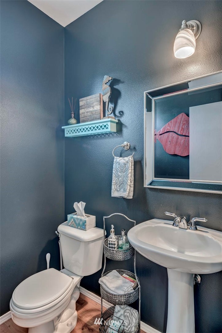34713 Southeast Ridge Street Snoqualmie, WA 98065 - Photo 13 of 22 a bathroom with a toilet a sink and mirror