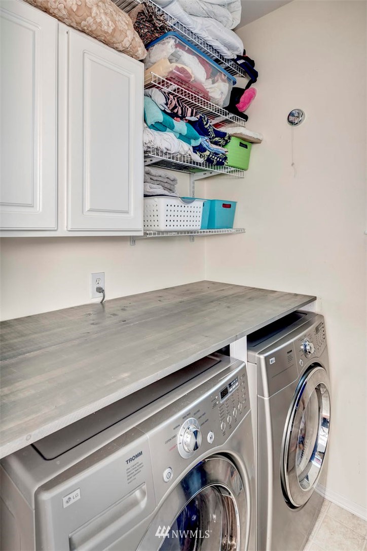 34713 Southeast Ridge Street Snoqualmie, WA 98065 - Photo 14 of 22 a utility room with dryer and washer