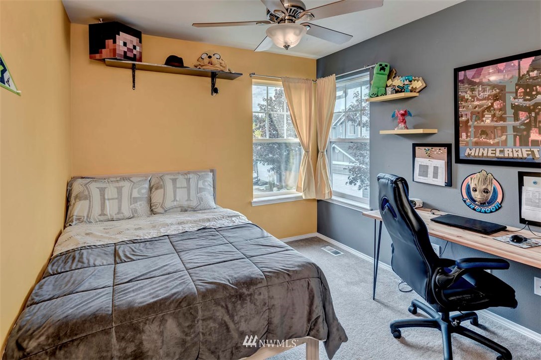 34713 Southeast Ridge Street Snoqualmie, WA 98065 - Photo 19 of 22 a bedroom with a bed and a table in it