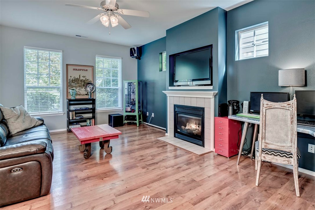 34713 Southeast Ridge Street Snoqualmie, WA 98065 - Photo 5 of 22 a living room with furniture and a flat screen tv