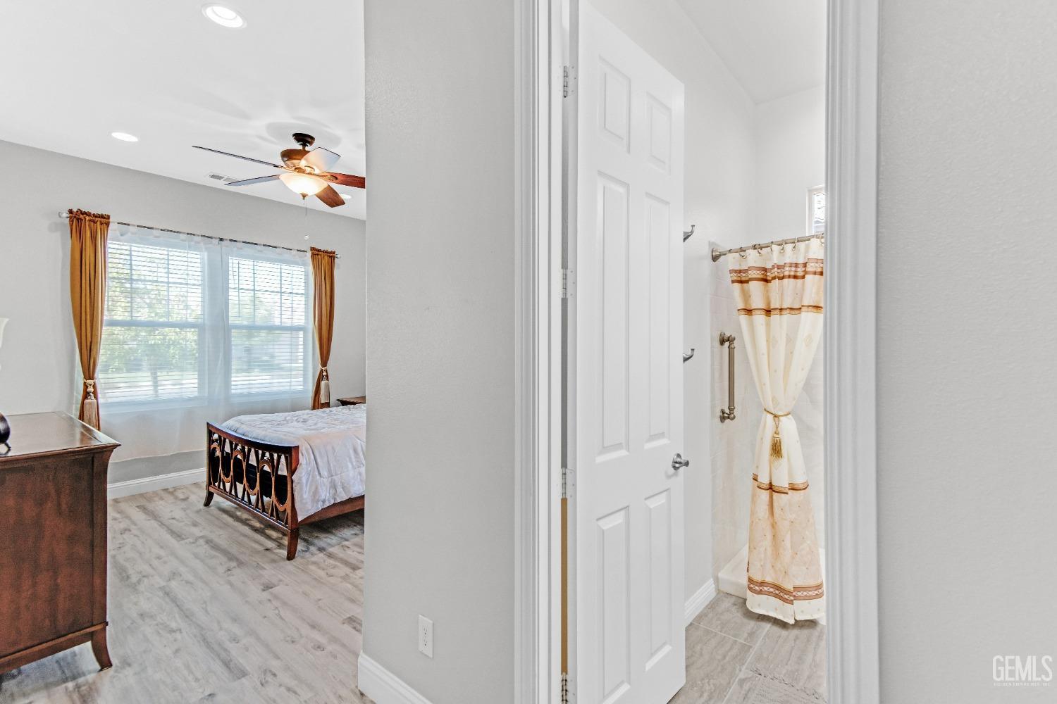 Undisclosed Address Bakersfield, CA 93306 - Photo 11 of 49 a living room with furniture and a window