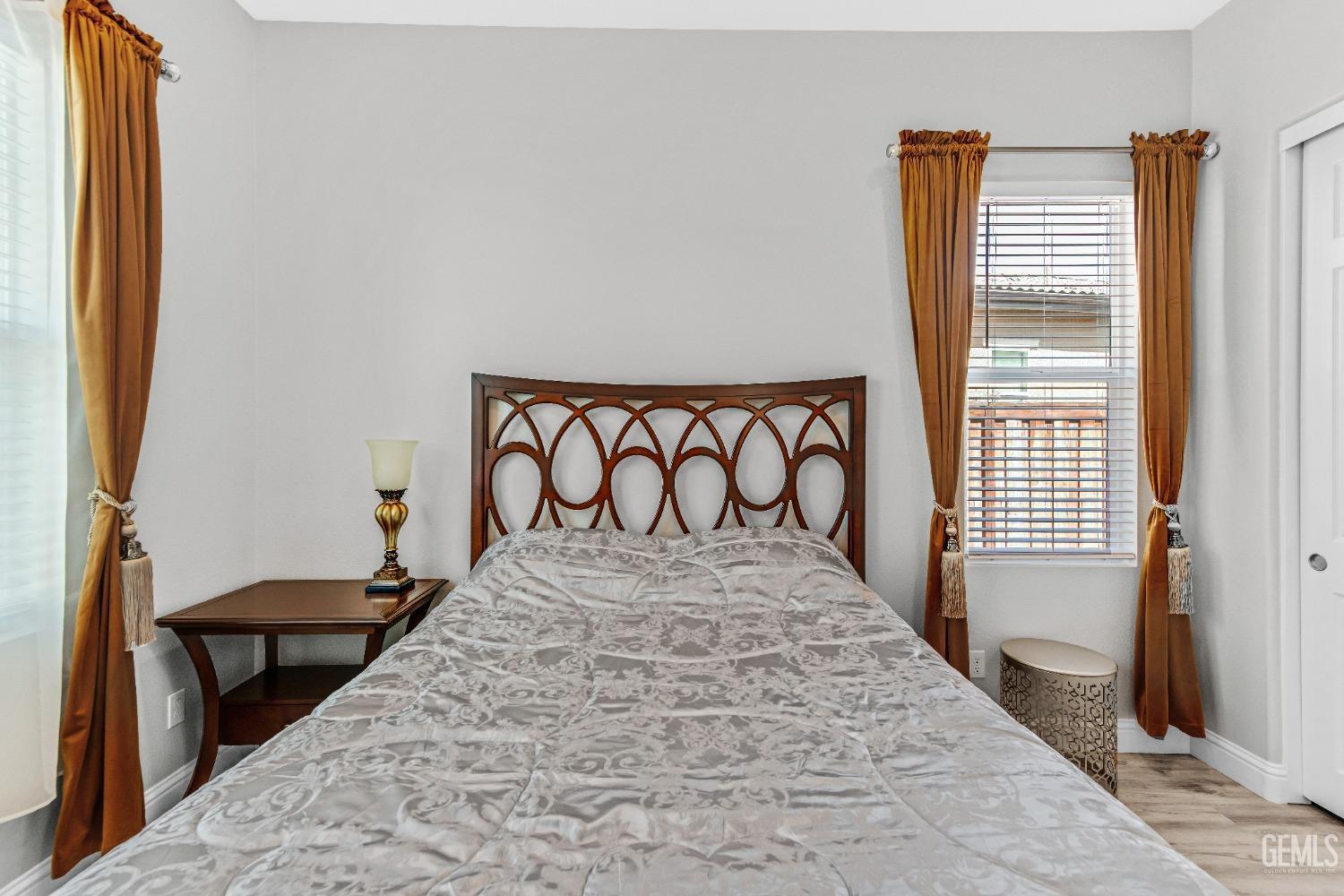 Undisclosed Address Bakersfield, CA 93306 - Photo 14 of 49 a bedroom with a bed and a window