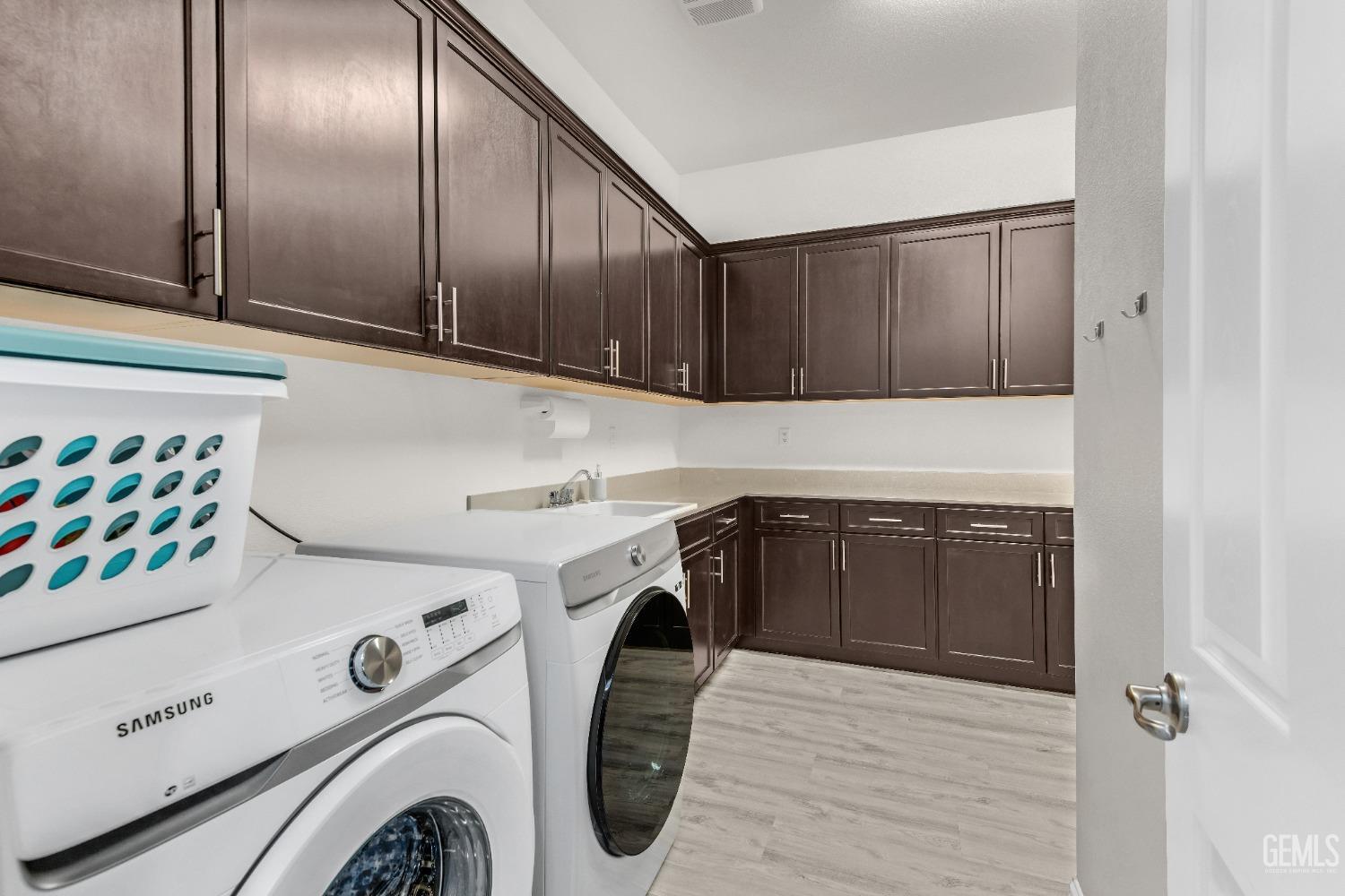 Undisclosed Address Bakersfield, CA 93306 - Photo 19 of 49 a utility room with dryer and washer