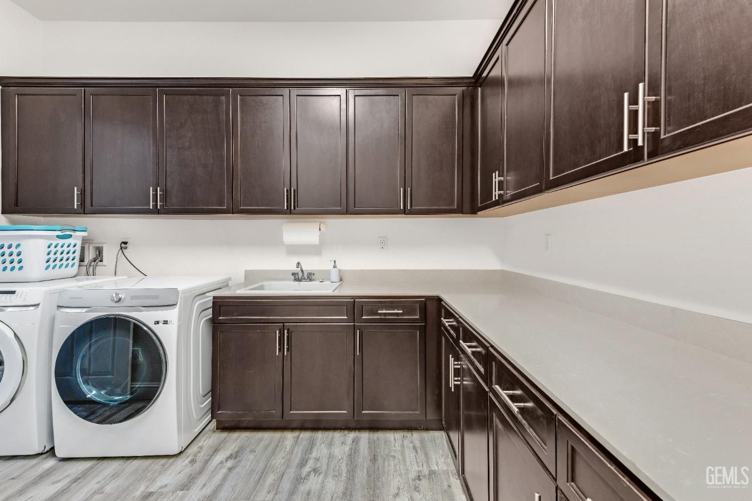 Undisclosed Address Bakersfield, CA 93306 - Photo 20 of 49 a kitchen with a sink and cabinets