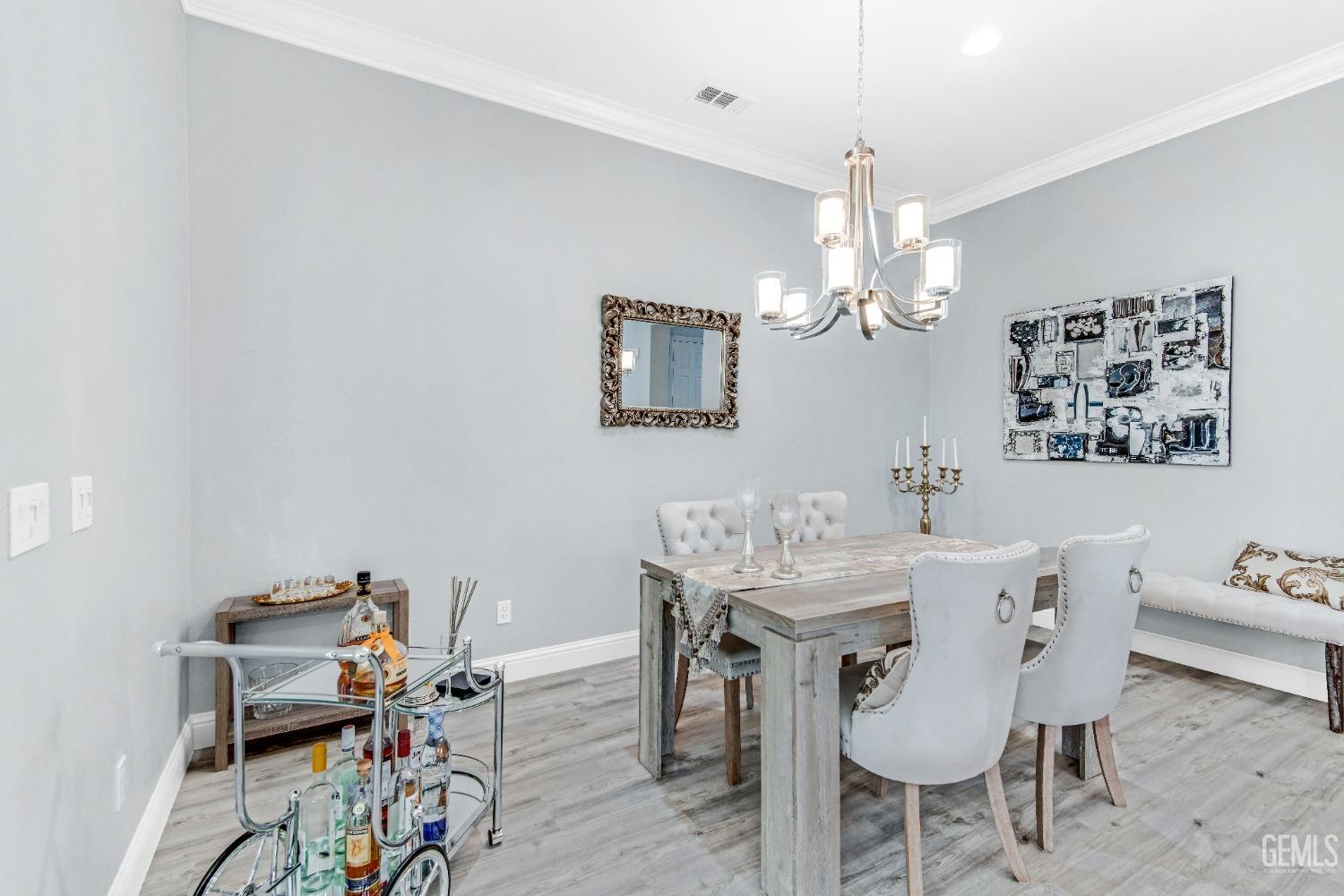 Undisclosed Address Bakersfield, CA 93306 - Photo 22 of 49 a view of a dining room with furniture and chandelier