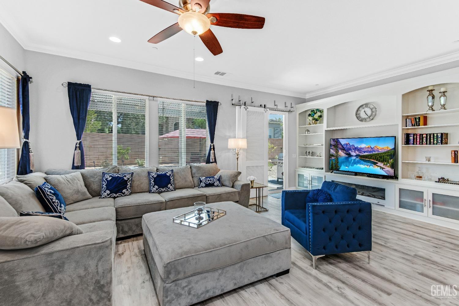 Undisclosed Address Bakersfield, CA 93306 - Photo 29 of 49 a living room with furniture and a flat screen tv