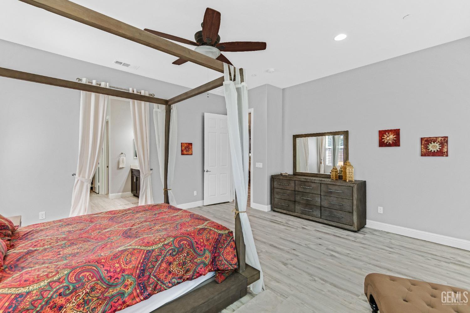 Undisclosed Address Bakersfield, CA 93306 - Photo 36 of 49 a bedroom with a bed and a dresser