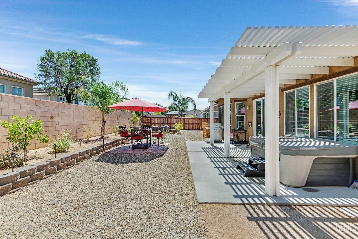 Undisclosed Address Bakersfield, CA 93306 - Photo 40 of 49 a view of a patio with table and chairs and potted plants