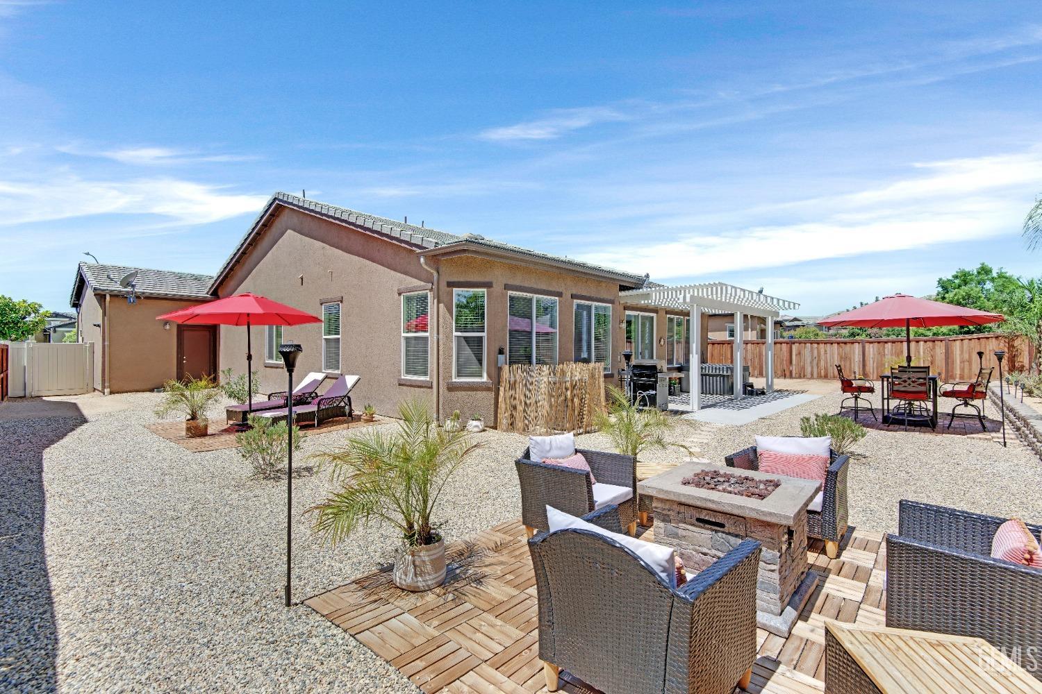 Undisclosed Address Bakersfield, CA 93306 - Photo 45 of 49 a view of a house with backyard sitting area