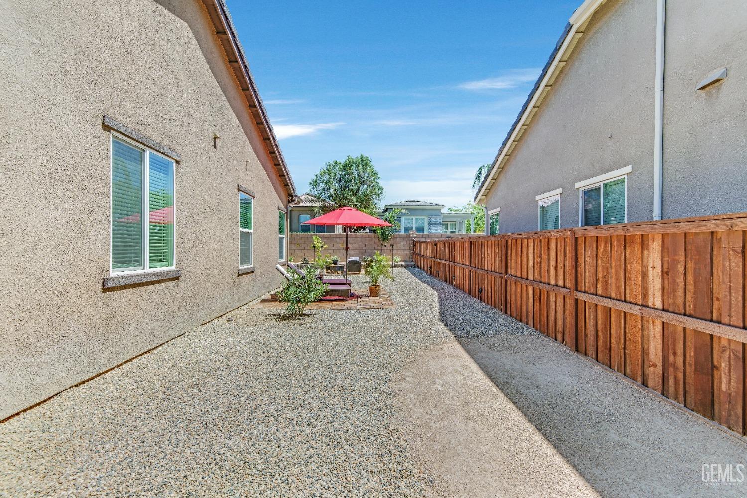 Undisclosed Address Bakersfield, CA 93306 - Photo 47 of 49 a view of a house with wooden floor and fence