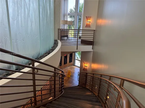 a bathroom with a toilet and a mirror