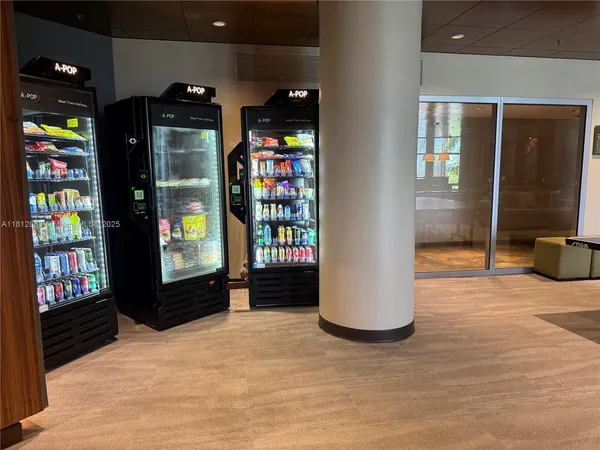 a room with gym equipment and large mirror