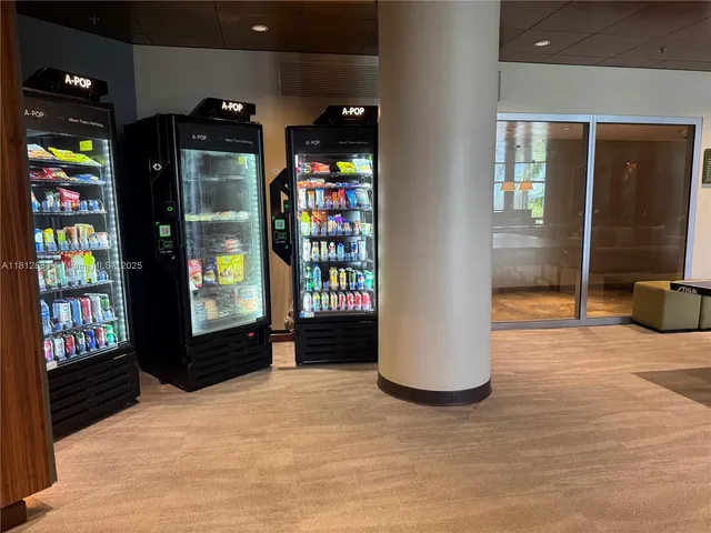 a room with gym equipment and large mirror