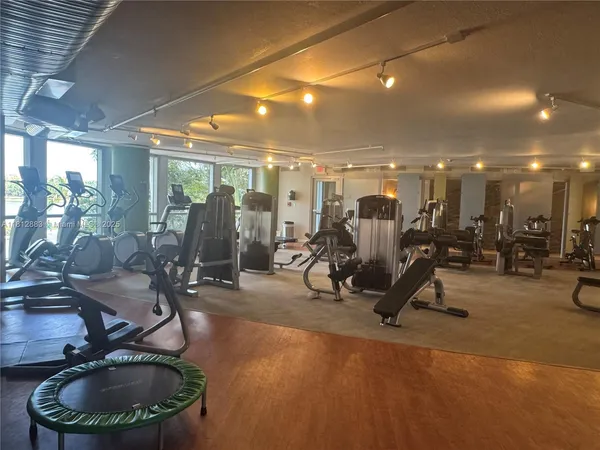 a bedroom with two beds and a couch