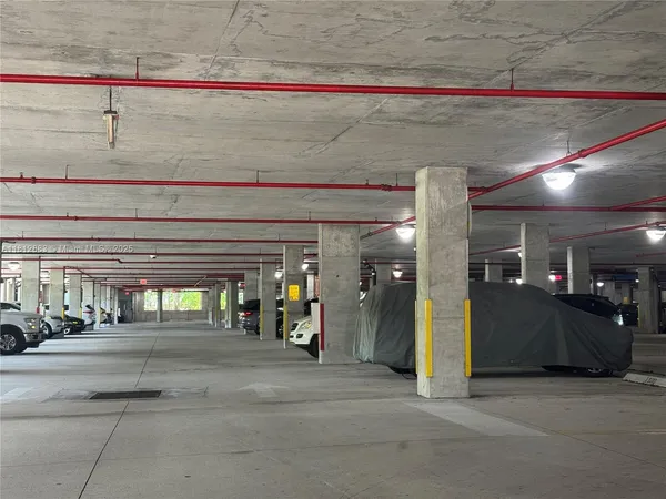a bathroom with a sink a toilet a mirror and shower