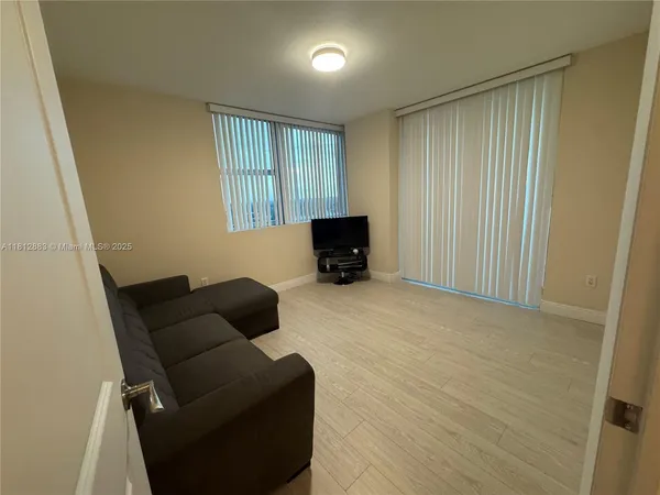 a kitchen with stainless steel appliances granite countertop a sink refrigerator and microwave