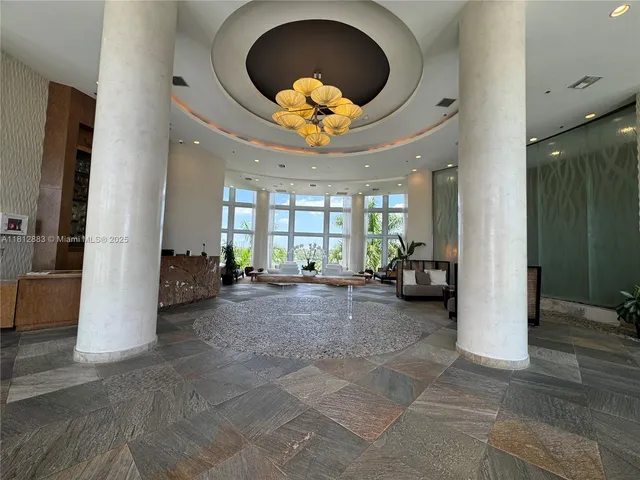 a view of a hallway with wooden floor and closet