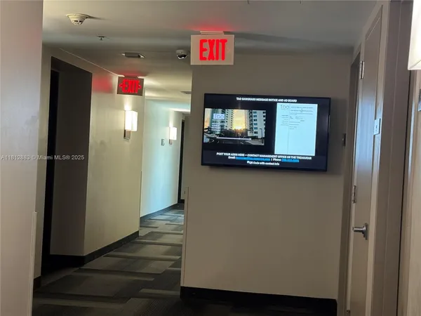 a view of a bathroom from a hallway