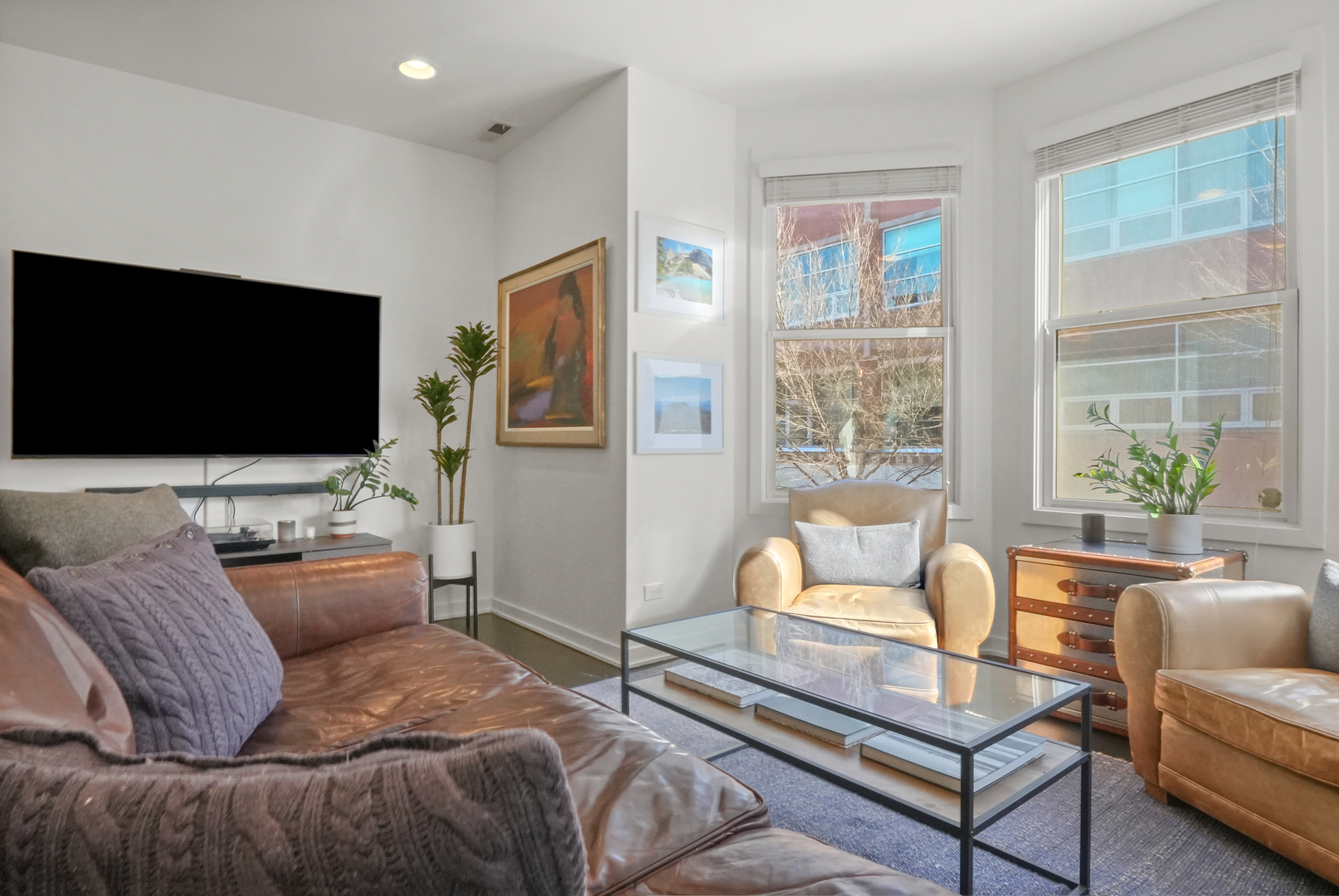 1735 West Division Street, Unit 204 Chicago, IL 60622 - Photo 13 of 26 a living room with furniture and a flat screen tv
