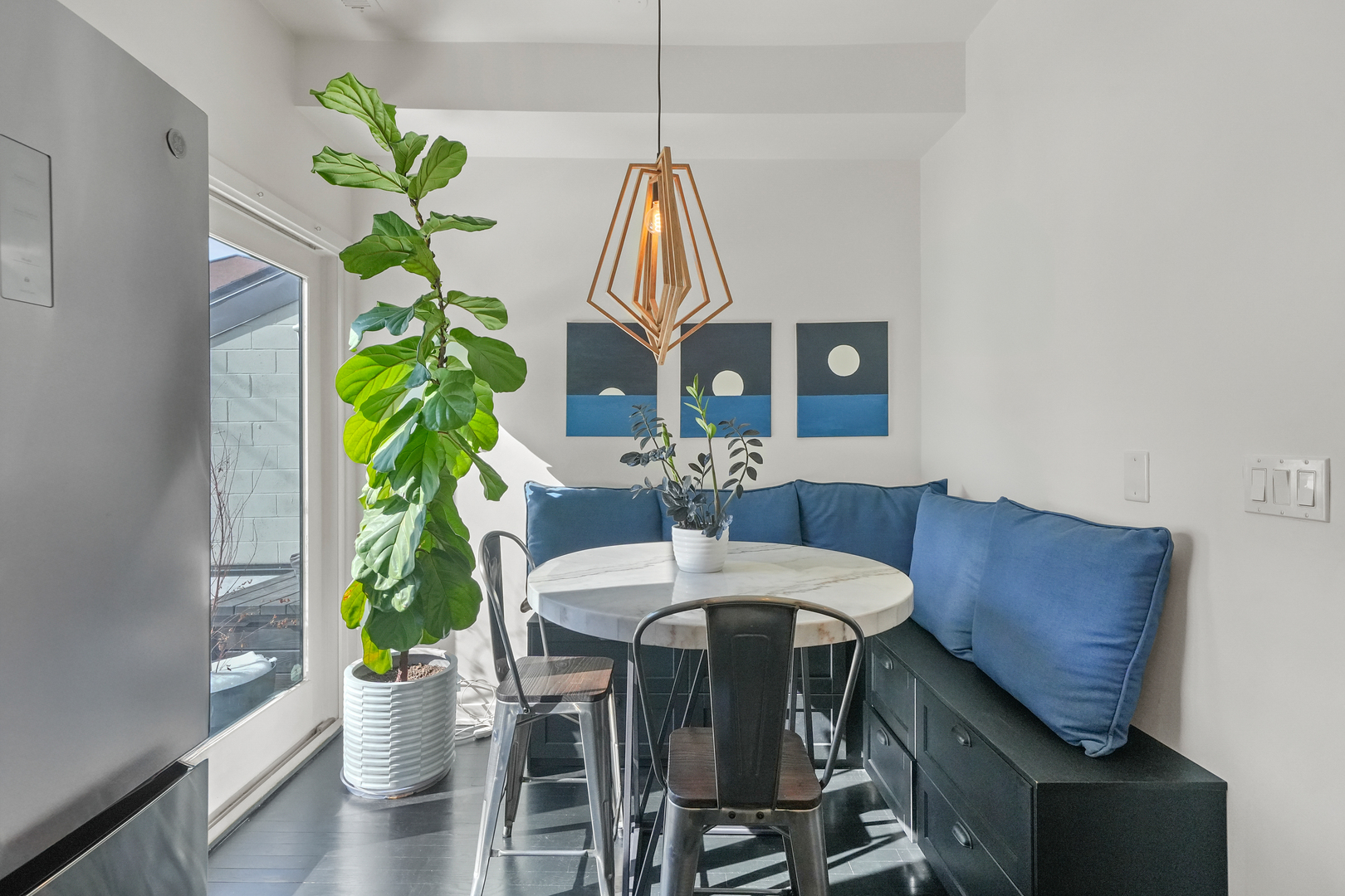 1735 West Division Street, Unit 204 Chicago, IL 60622 - Photo 7 of 26 a dining room filled with furniture and a potted plant