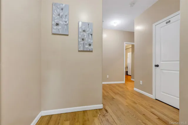 an empty room with painting on the wall