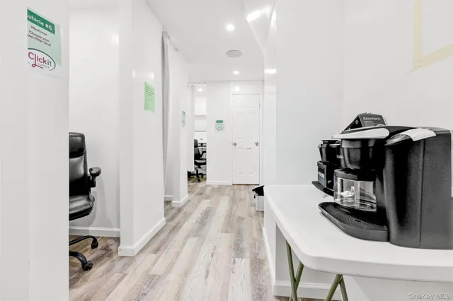 a kitchen with stainless steel appliances a stove a refrigerator and cabinets