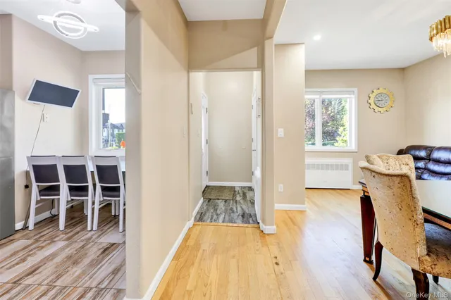 a view of a bedroom with furniture and wooden floor