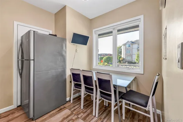 a dining room with furniture and window