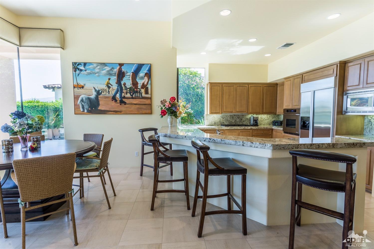 314 Loch Lomond Road Rancho Mirage, CA 92270 - Photo 26 of 48 a kitchen with a table and chairs in it