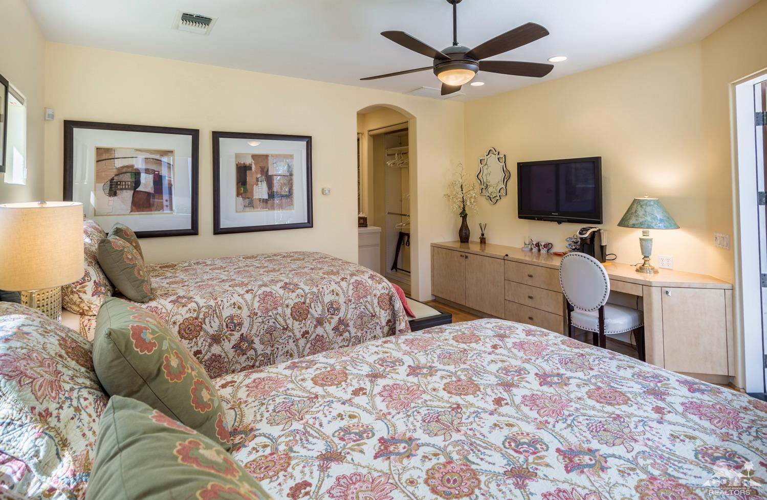 314 Loch Lomond Road Rancho Mirage, CA 92270 - Photo 32 of 48 a bedroom with a bed and a desk
