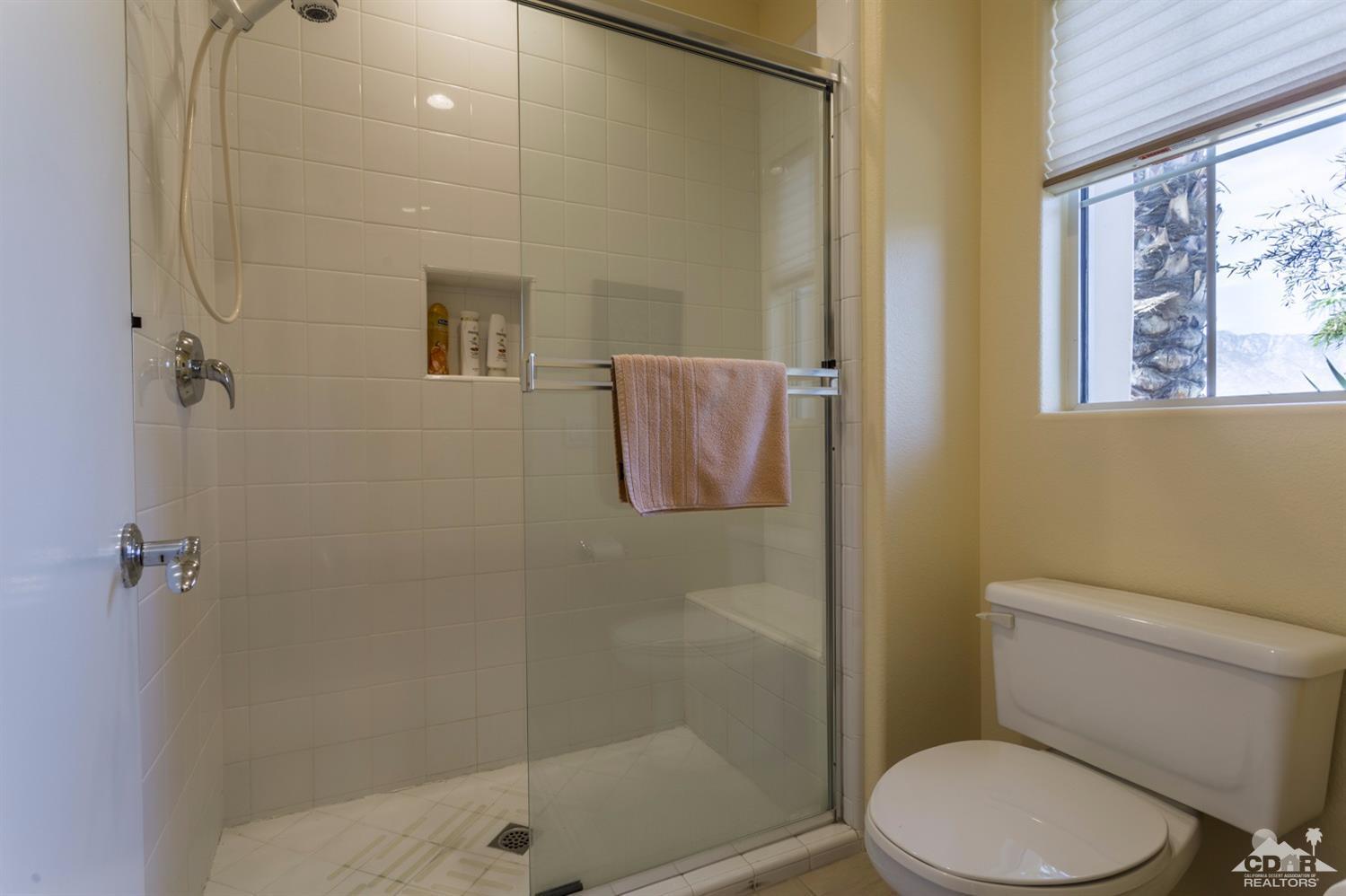 314 Loch Lomond Road Rancho Mirage, CA 92270 - Photo 33 of 48 a white toilet sitting next to a bathroom sink