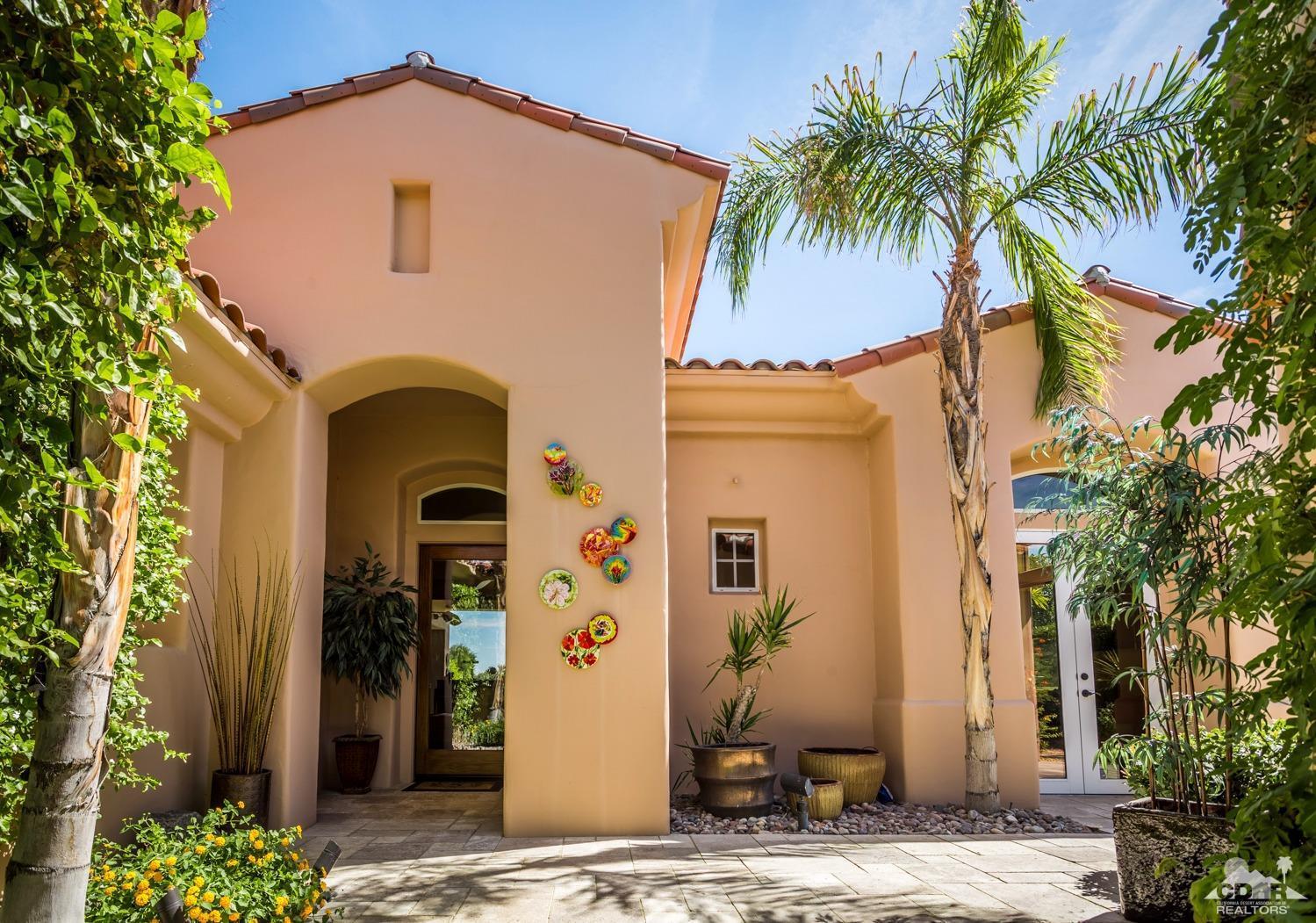 314 Loch Lomond Road Rancho Mirage, CA 92270 - Photo 35 of 48 a front view of a house with a yard