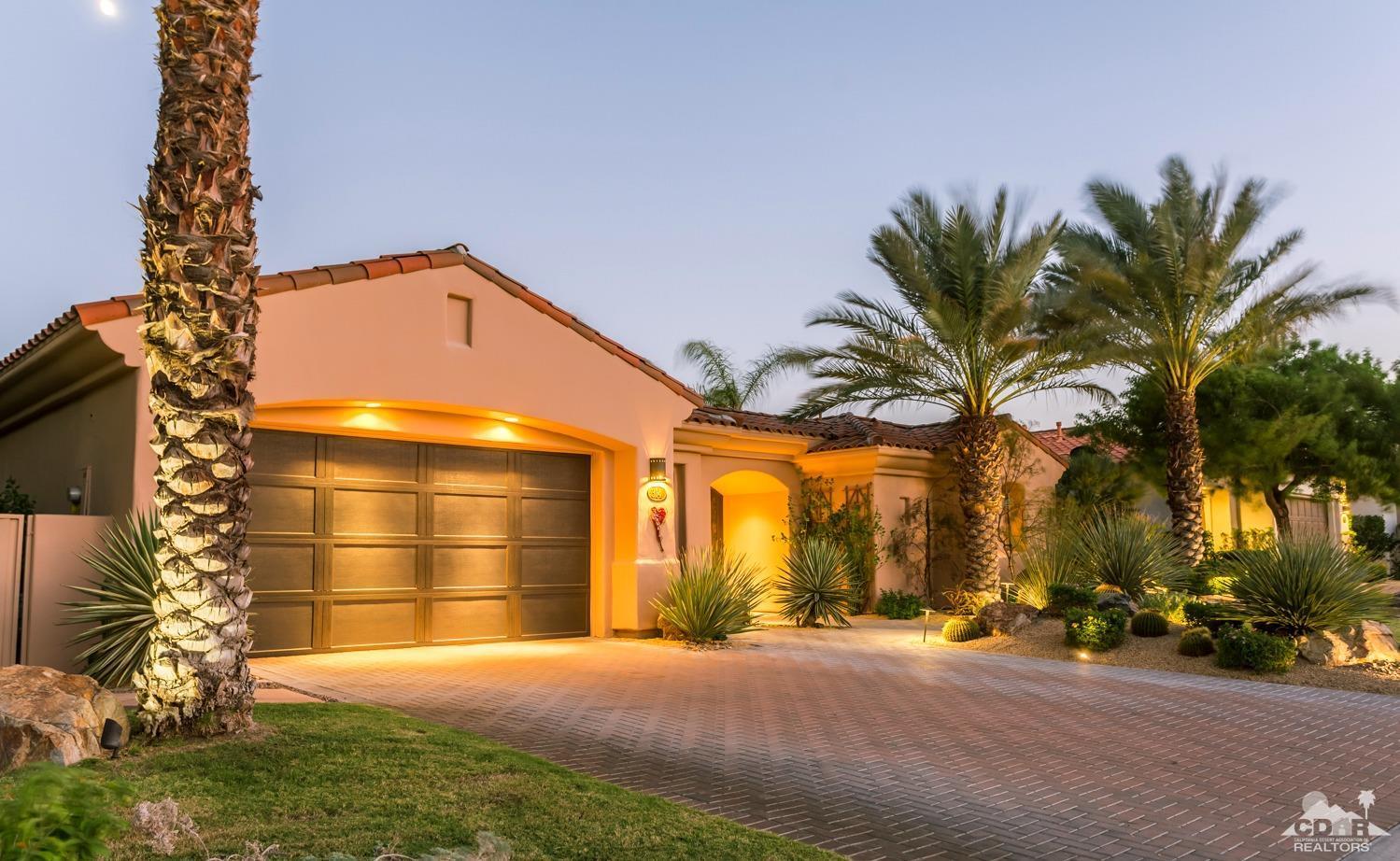 314 Loch Lomond Road Rancho Mirage, CA 92270 - Photo 37 of 48 a front view of a house with a yard and garage