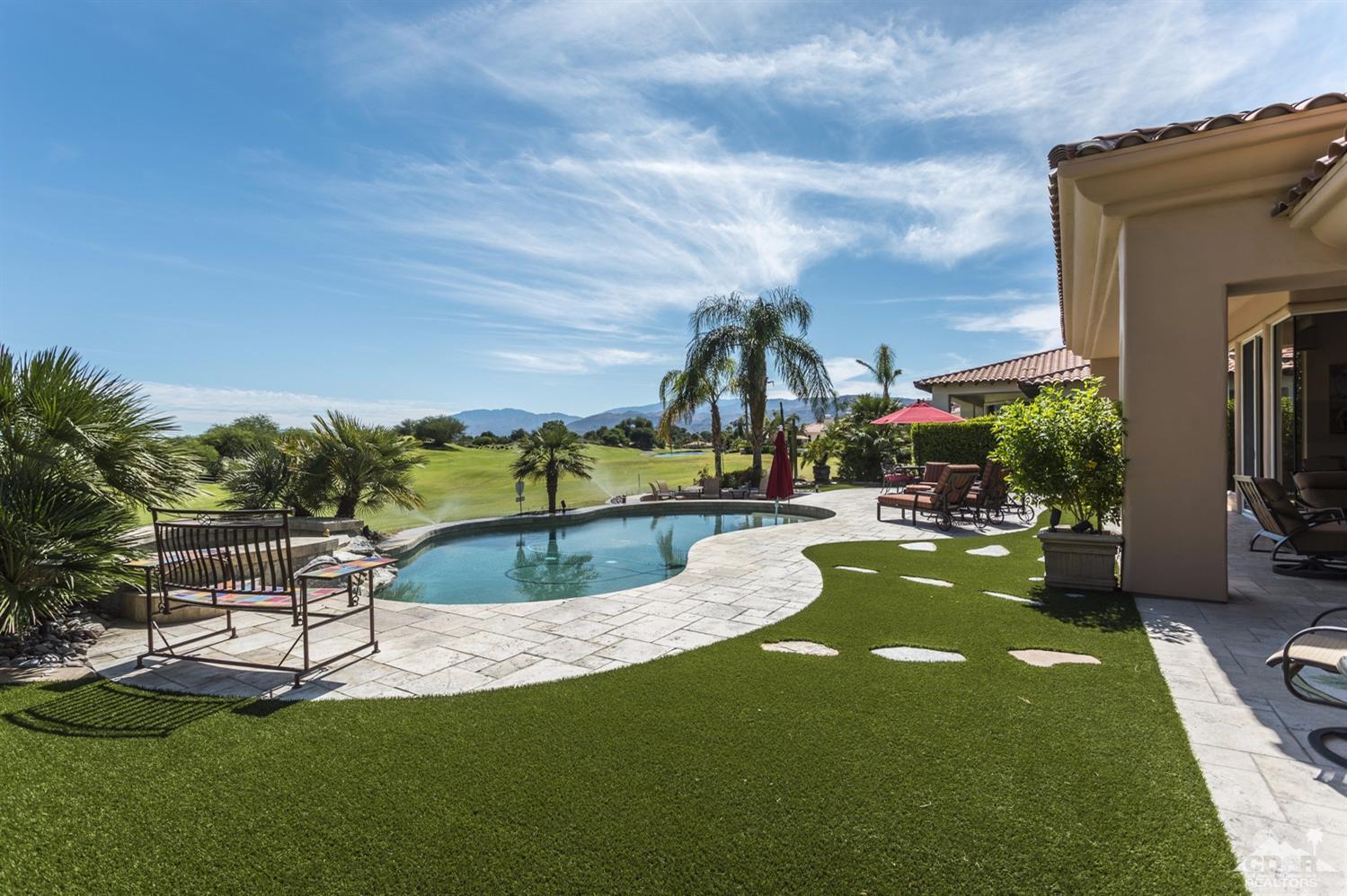 314 Loch Lomond Road Rancho Mirage, CA 92270 - Photo 4 of 48 a view of a swimming pool with a garden