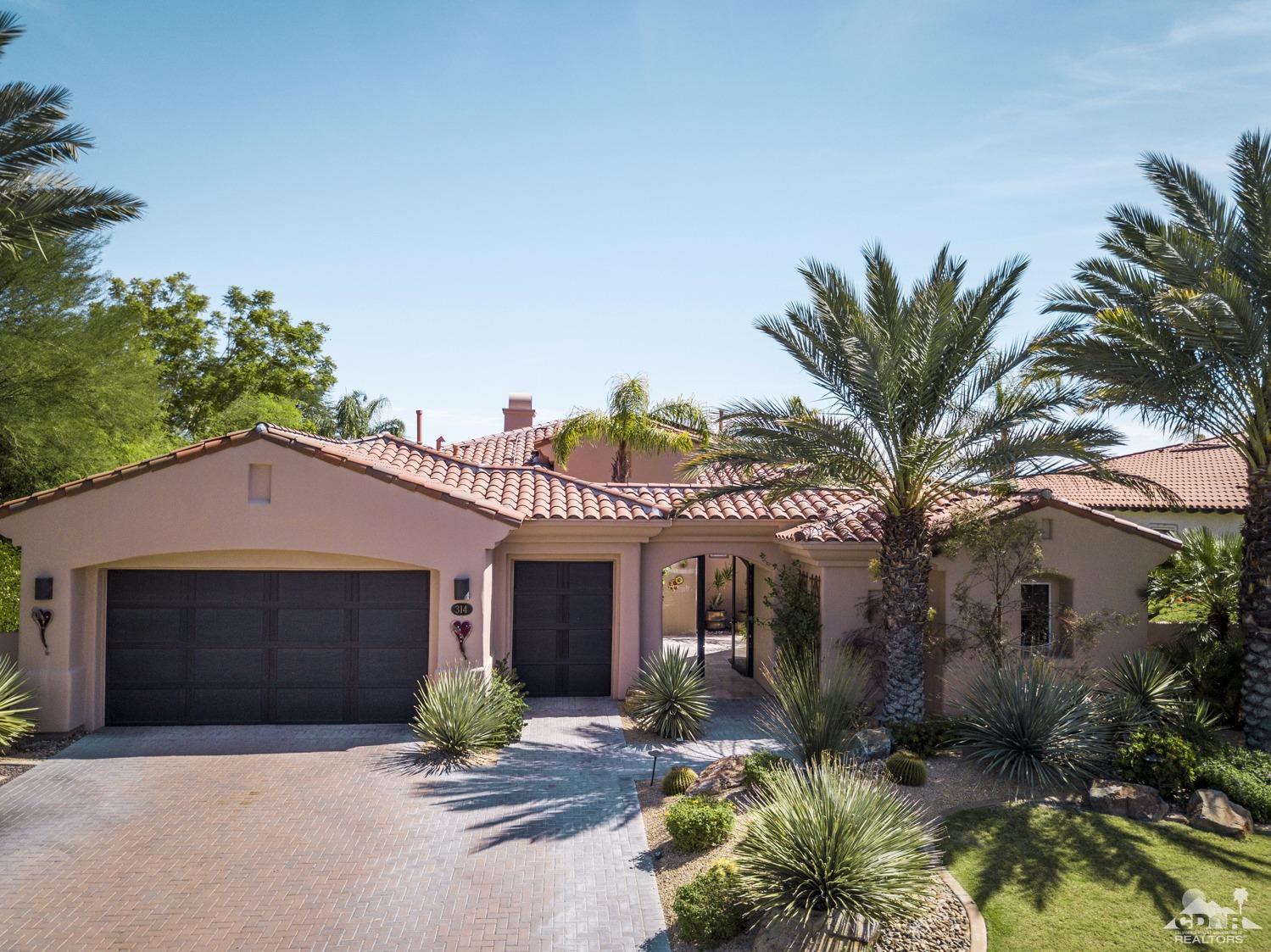 314 Loch Lomond Road Rancho Mirage, CA 92270 - Photo 46 of 48 a front view of a house with a garden and outdoor seating